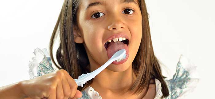 Little girl brushing her teeth's
